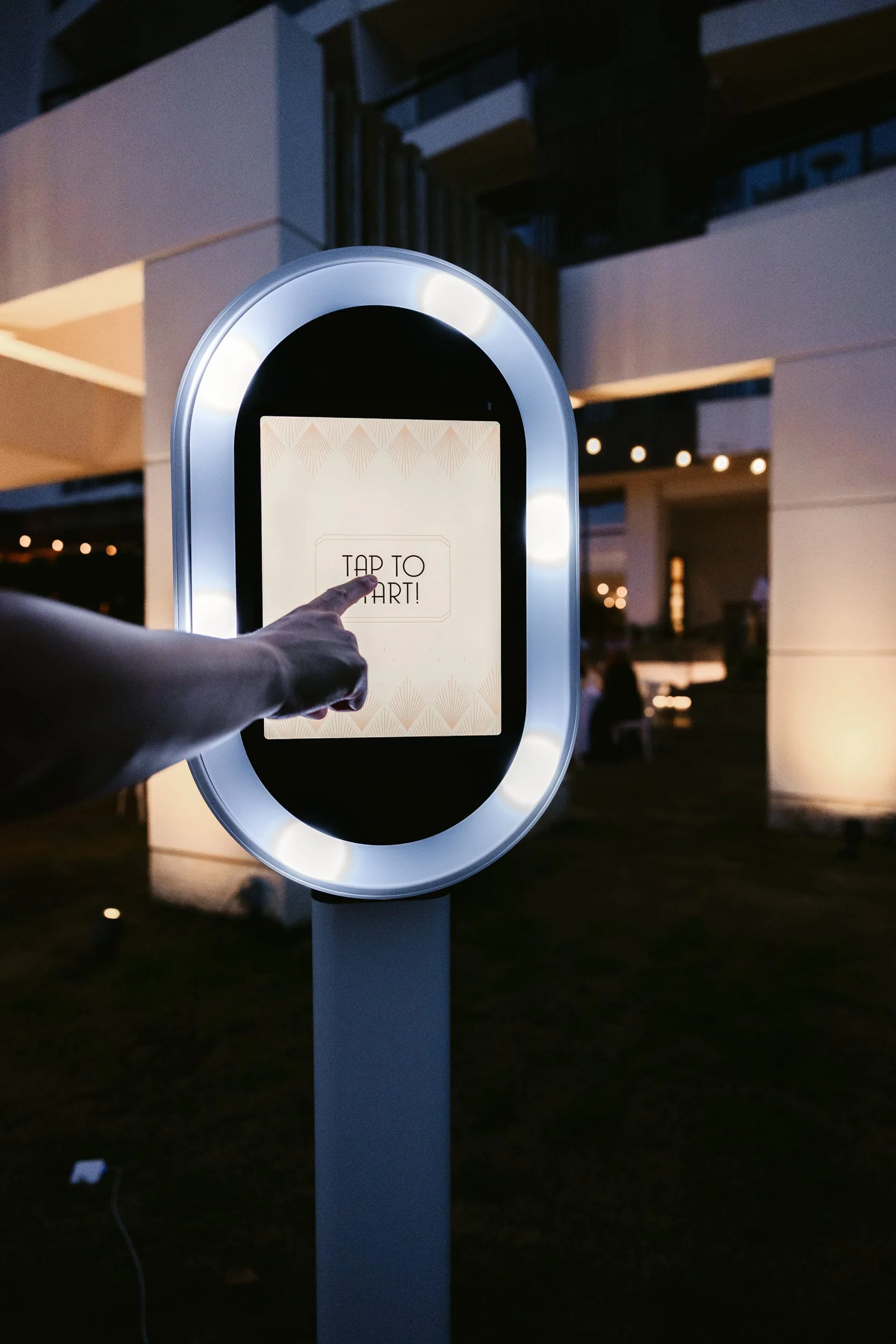 Guests posing at a digital photo booth